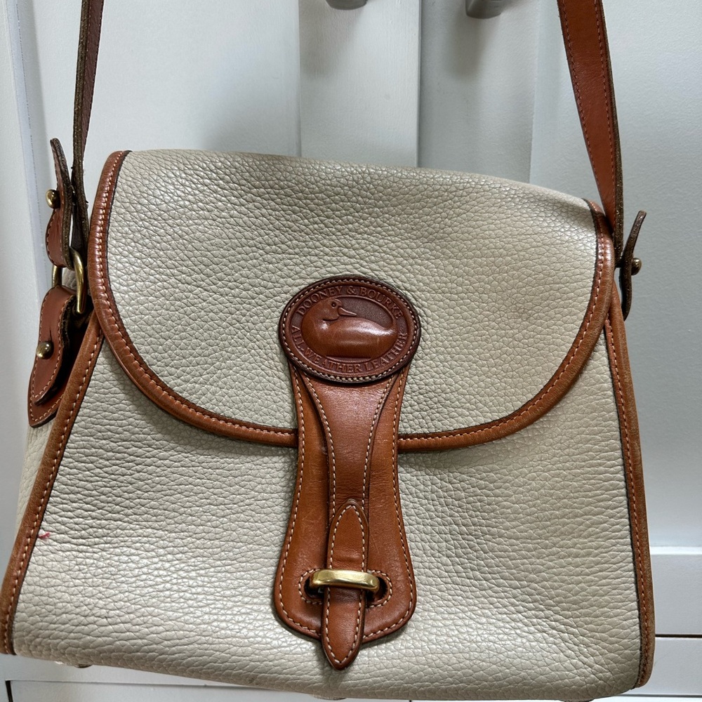 Dooney & Bourke Cream and Brown Pebbled Leather Shoulder Bag with Brass Accent